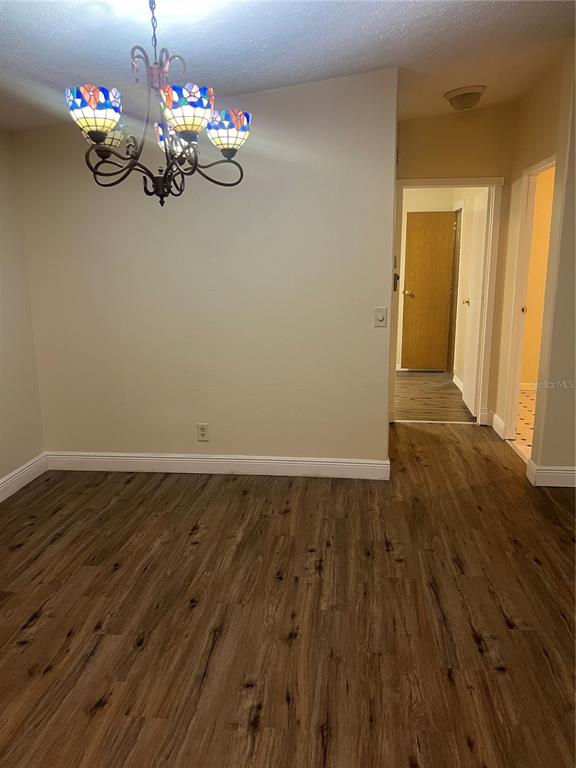 2833 Southeast 18th Terrace Okeechobee, FL 34974 - Photo 13 of 34 a view of a room with wooden floor