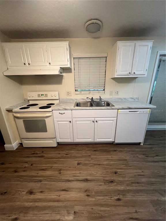 2833 Southeast 18th Terrace Okeechobee, FL 34974 - Photo 14 of 34 a kitchen with stainless steel appliances granite countertop a sink a stove and cabinets
