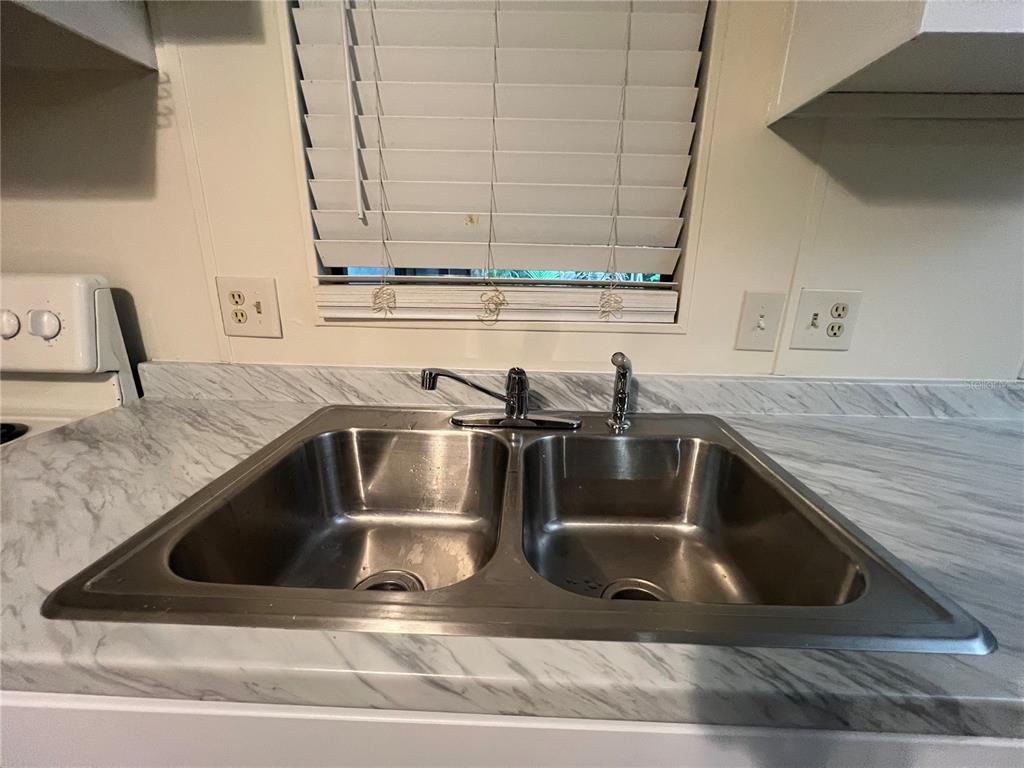 2833 Southeast 18th Terrace Okeechobee, FL 34974 - Photo 15 of 34 a close view of sink and tap