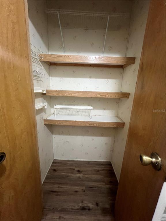 2833 Southeast 18th Terrace Okeechobee, FL 34974 - Photo 22 of 34 a washer and dryer sitting on a shelf