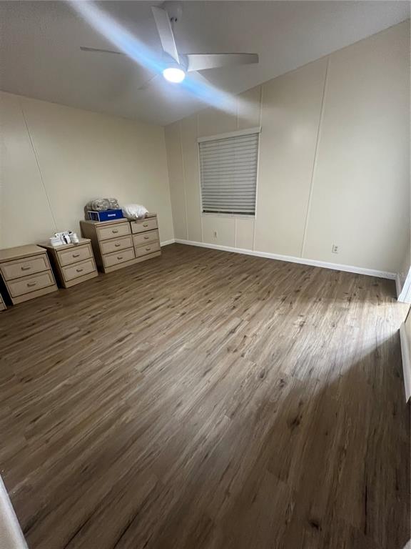 2833 Southeast 18th Terrace Okeechobee, FL 34974 - Photo 23 of 34 a living room with furniture and a wooden floor