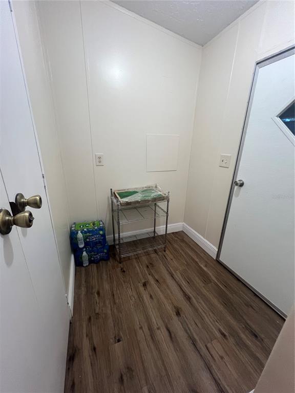 2833 Southeast 18th Terrace Okeechobee, FL 34974 - Photo 34 of 34 a view of wooden floor and chair in a room
