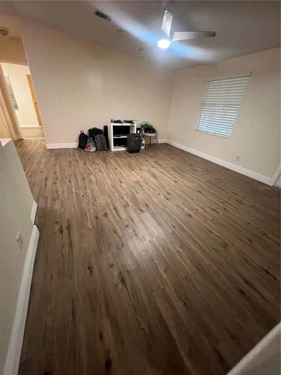 2833 Southeast 18th Terrace Okeechobee, FL 34974 - Photo 10 of 34 a view of a room with wooden floor