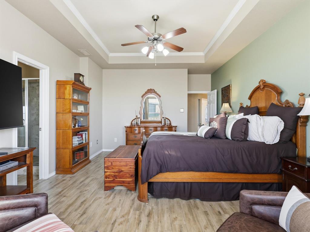 783 Christy Kay Lane Rhome, TX 76078 - Photo 13 of 31 a bedroom with a bed and wooden floor