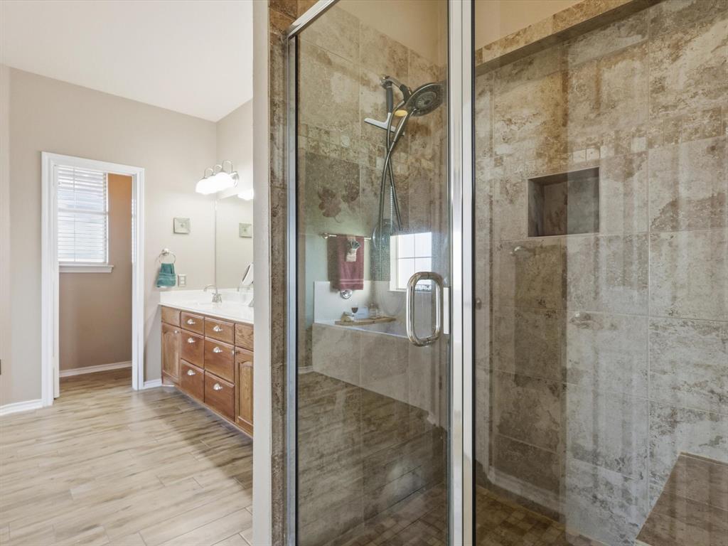 783 Christy Kay Lane Rhome, TX 76078 - Photo 16 of 31 a bathroom with a glass shower door and a sink
