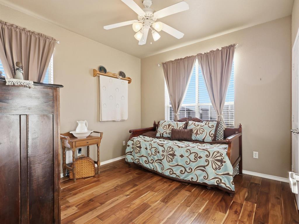 783 Christy Kay Lane Rhome, TX 76078 - Photo 19 of 31 a bedroom with a bed and wooden floor