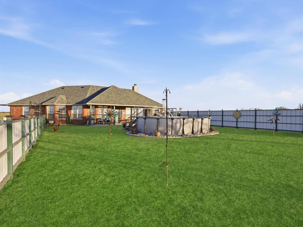 783 Christy Kay Lane Rhome, TX 76078 - Photo 25 of 31 a view of a big house with a big yard and large trees