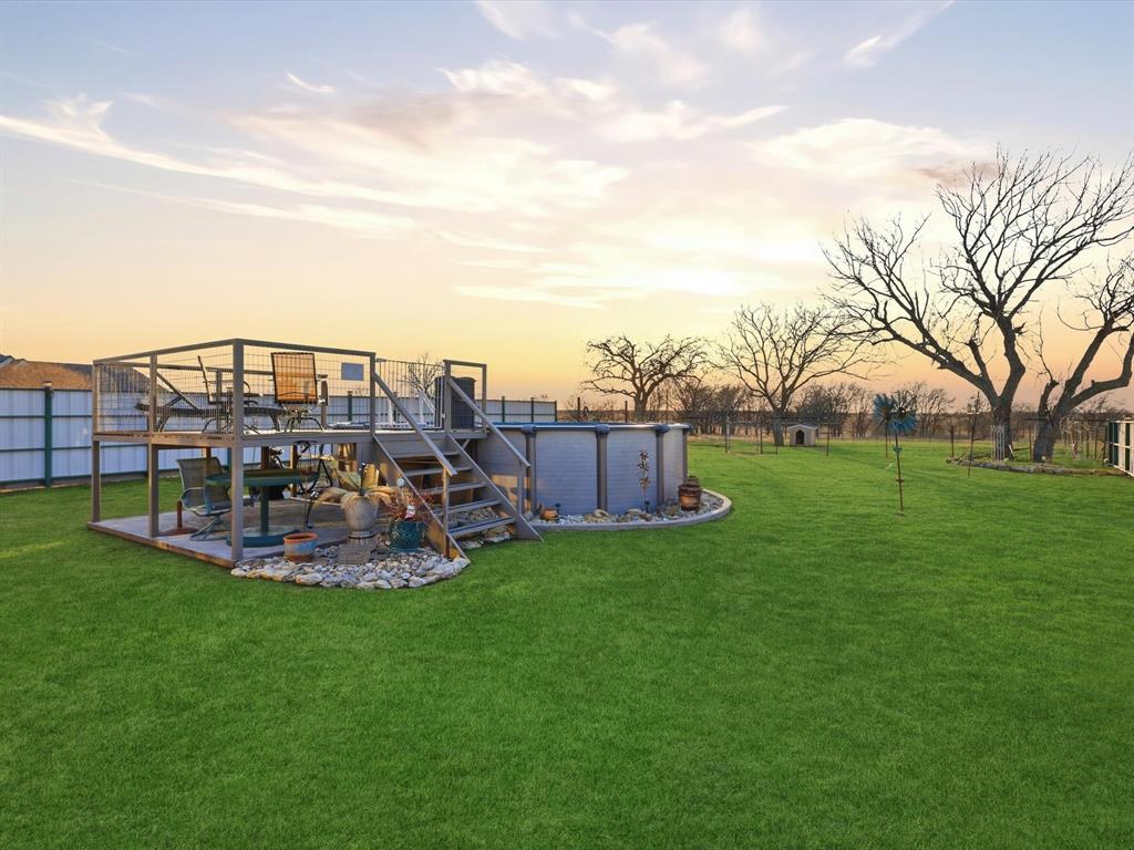 783 Christy Kay Lane Rhome, TX 76078 - Photo 26 of 31 a view of a house with a big yard and a fountain