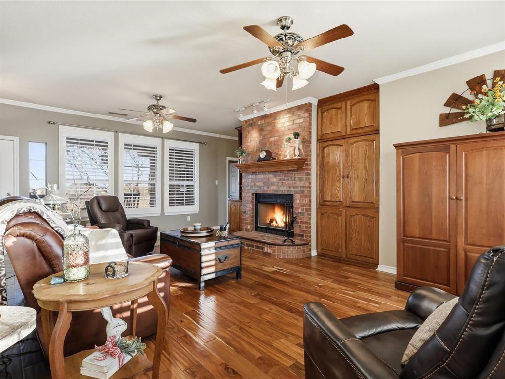 783 Christy Kay Lane Rhome, TX 76078 - Photo 7 of 31 a living room with furniture fireplace and a table