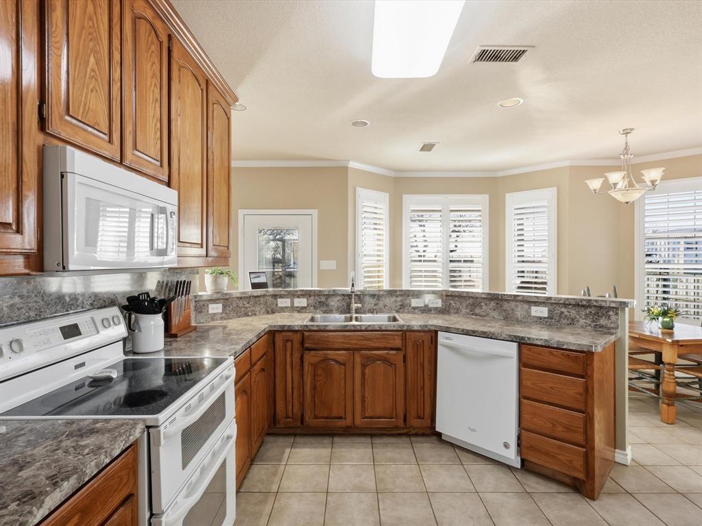 783 Christy Kay Lane Rhome, TX 76078 - Photo 8 of 31 a kitchen with a sink stove and cabinets