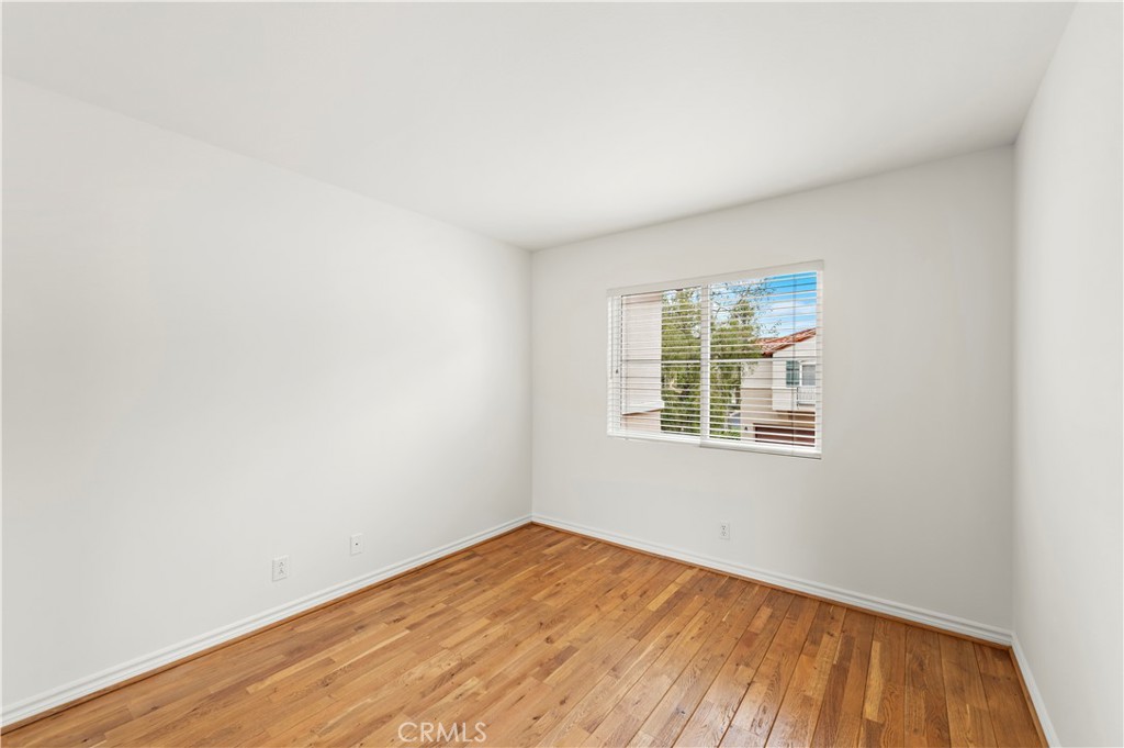 Undisclosed Address Newport Coast, CA 92657 - Photo 15 of 26 an empty room with wooden floor and windows