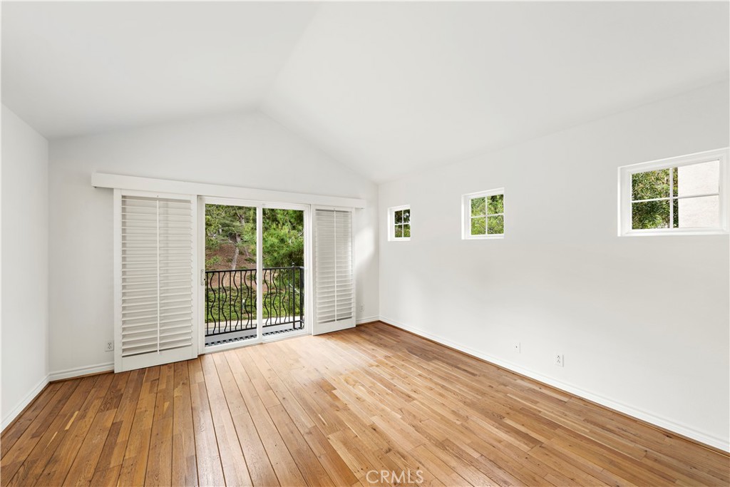 Undisclosed Address Newport Coast, CA 92657 - Photo 18 of 26 an empty room with wooden floor and windows