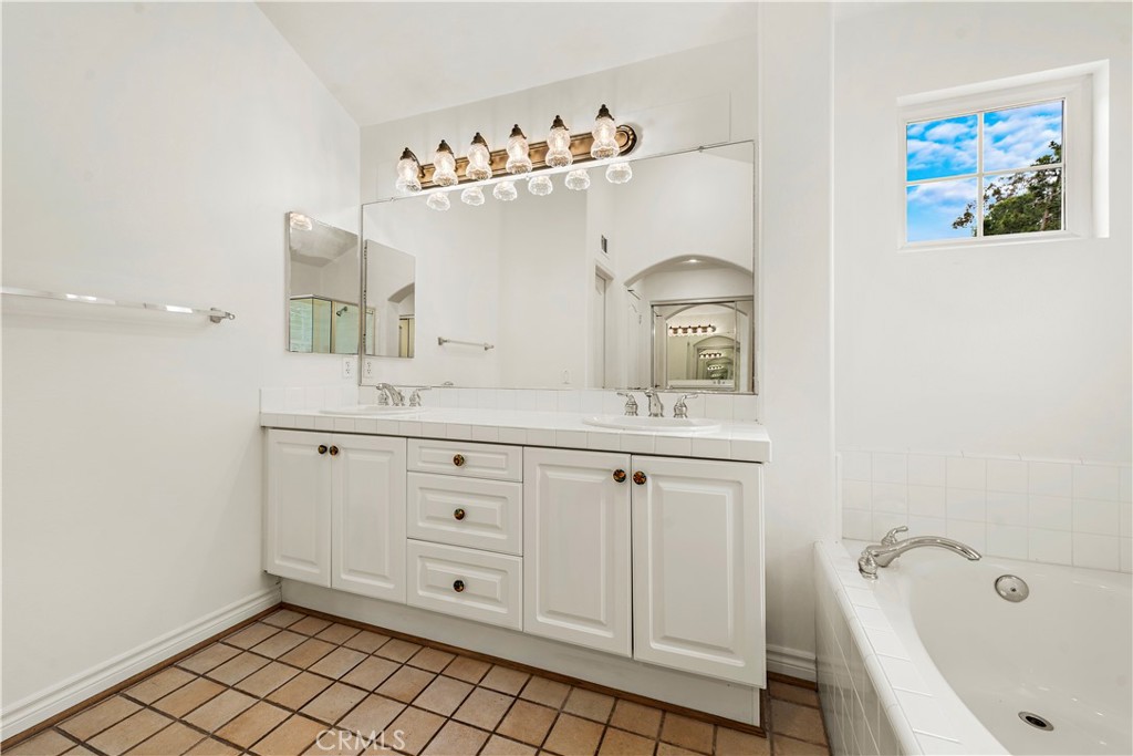 Undisclosed Address Newport Coast, CA 92657 - Photo 19 of 26 a spacious bathroom with a double vanity sink mirror and bathtub