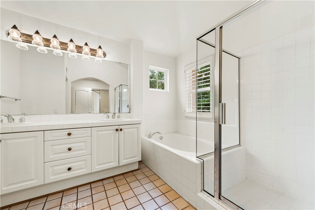 Undisclosed Address Newport Coast, CA 92657 - Photo 20 of 26 a bathroom with a tub sink and mirror