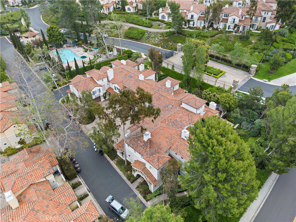 Undisclosed Address Newport Coast, CA 92657 - Photo 24 of 26 an aerial view of a house with a yard and lake