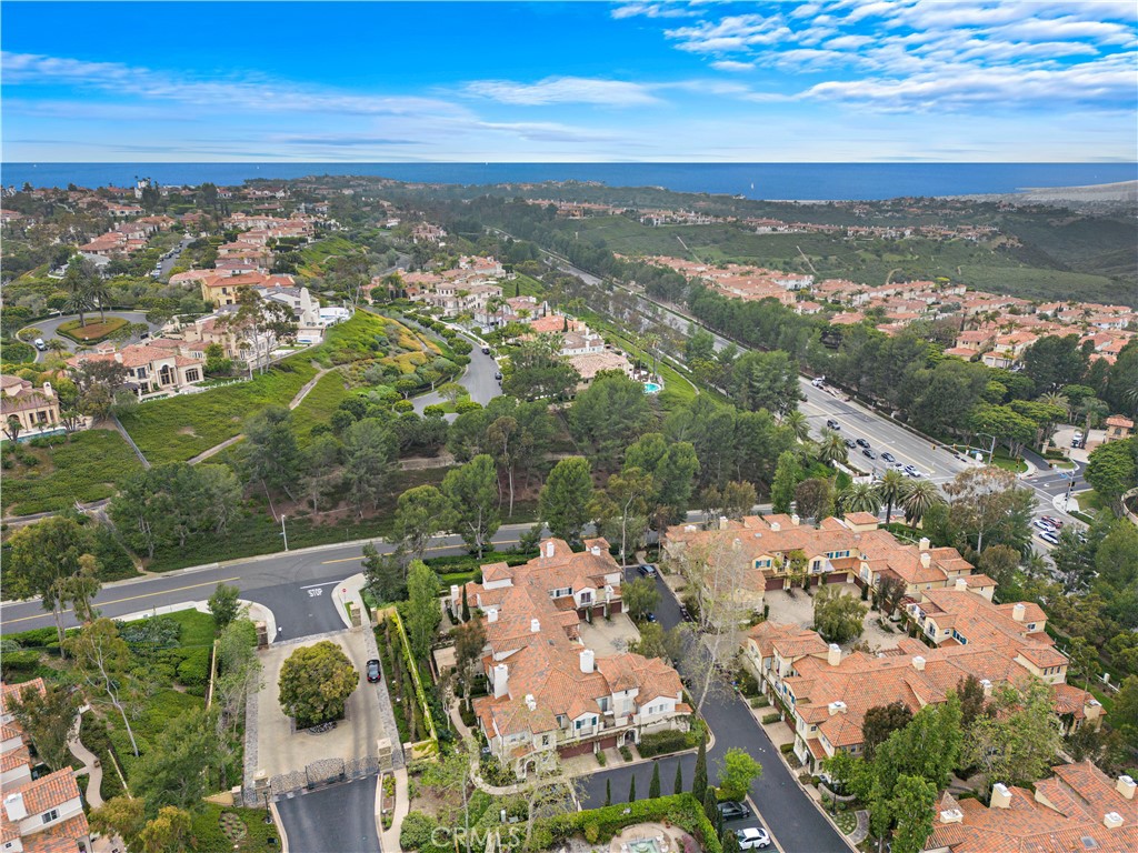 Undisclosed Address Newport Coast, CA 92657 - Photo 26 of 26 an aerial view of a city with lots of residential buildings ocean and mountain view in back