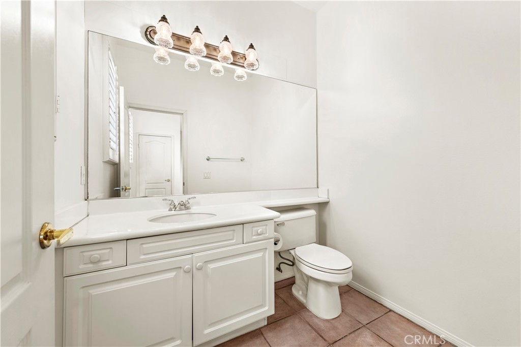 Undisclosed Address Newport Coast, CA 92657 - Photo 6 of 26 a bathroom with a sink toilet and mirror
