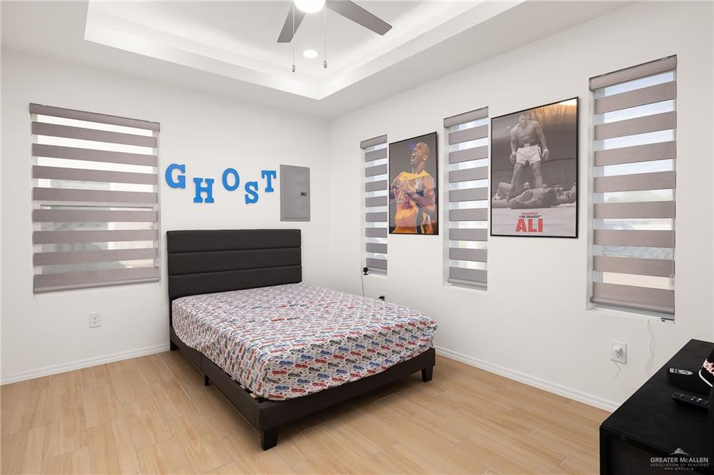 1527 West B Street Mission, TX 78572 - Photo 16 of 17 a bedroom with a bed and a window