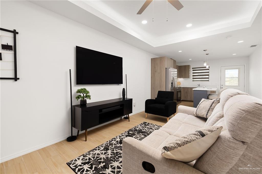 1527 West B Street Mission, TX 78572 - Photo 3 of 17 a living room with furniture and a flat screen tv