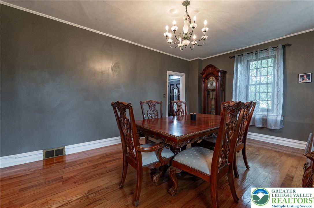2485 Hieter Road Quakertown, PA 18951 - Photo 24 of 97 A classic chandelier illuminates the polished hardwood flooring in this elegant dining room.