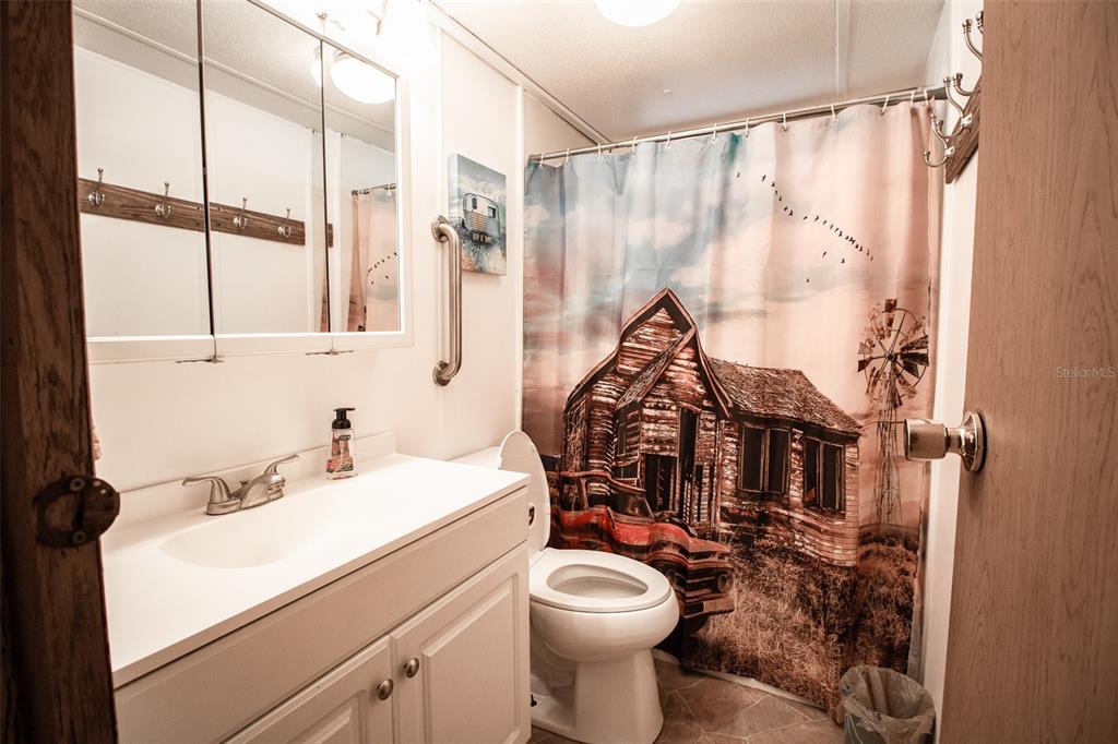 11 Sycamore Street Flagler Beach, FL 32136 - Photo 16 of 21 a bathroom with a sink toilet and shower