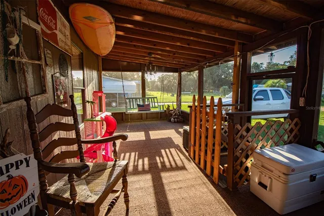 a view of a living room and a wooden floor
