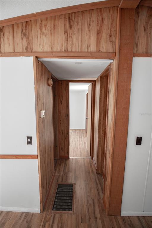 11 Sycamore Street Flagler Beach, FL 32136 - Photo 8 of 21 a room with wooden floor and furniture