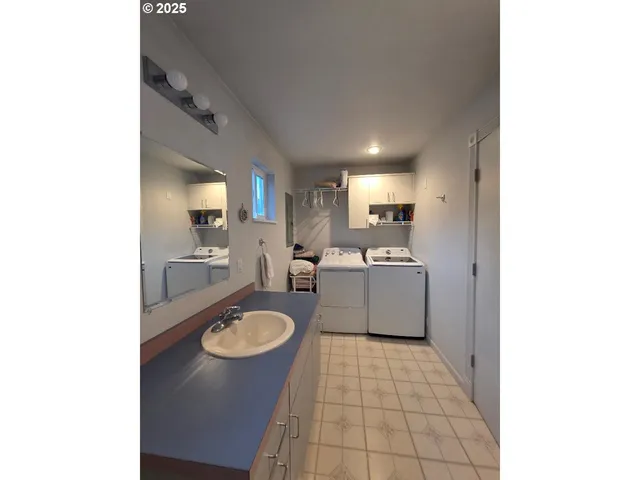 a bedroom with a bed and a desk