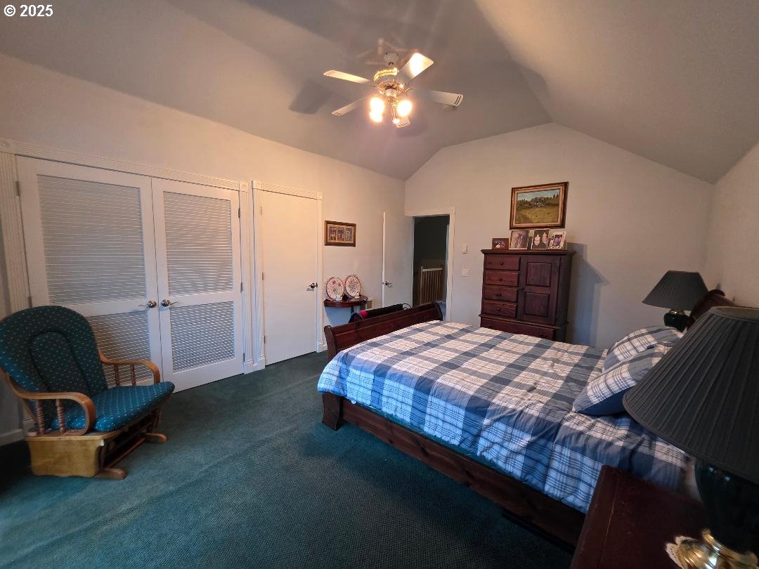 271 South Fairway Road Tygh Valley, OR 97063 - Photo 35 of 43 a bedroom with a bed and a chandelier