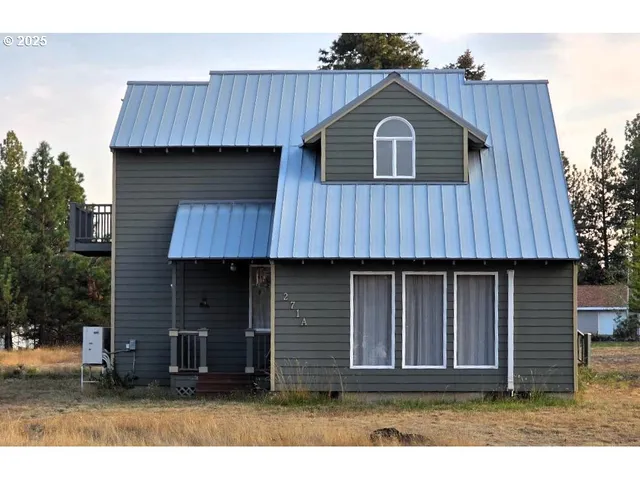 a front view of a house with a wooden fence