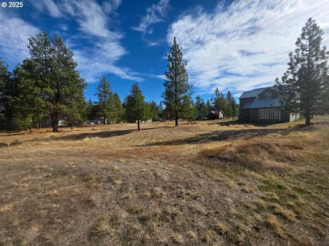 a house with yard in front of it