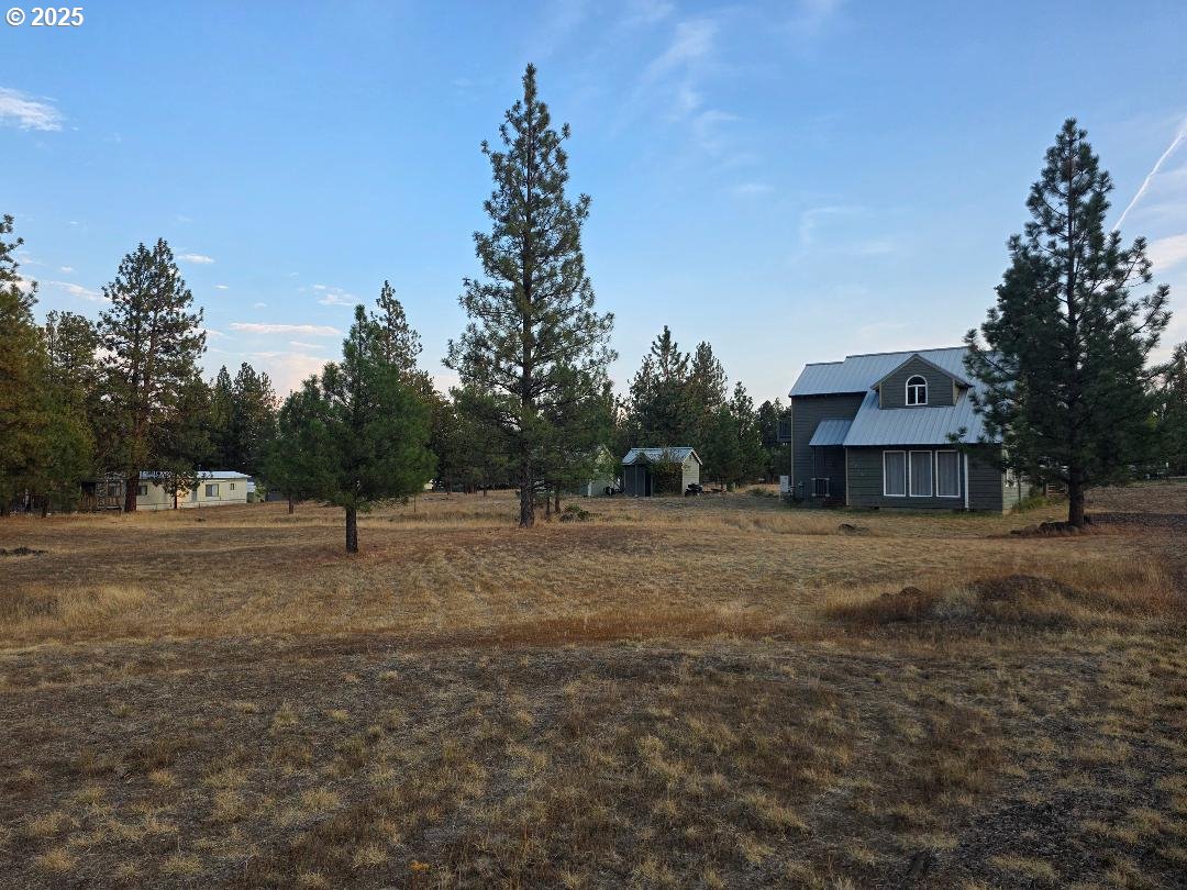 271 South Fairway Road Tygh Valley, OR 97063 - Photo 7 of 43 a view of a big yard with large trees