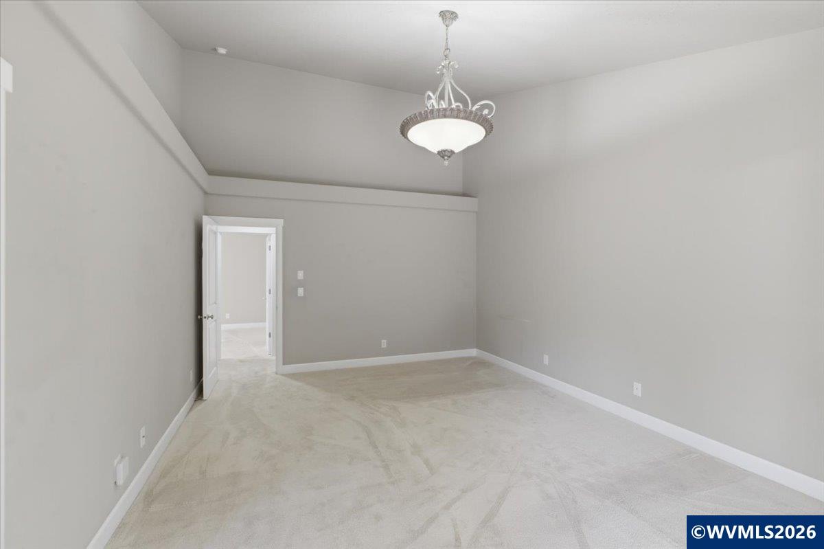 2359 Northwest Gale Street Albany, OR 97321 - Photo 29 of 47 en empty room with a chandelier fan and a window