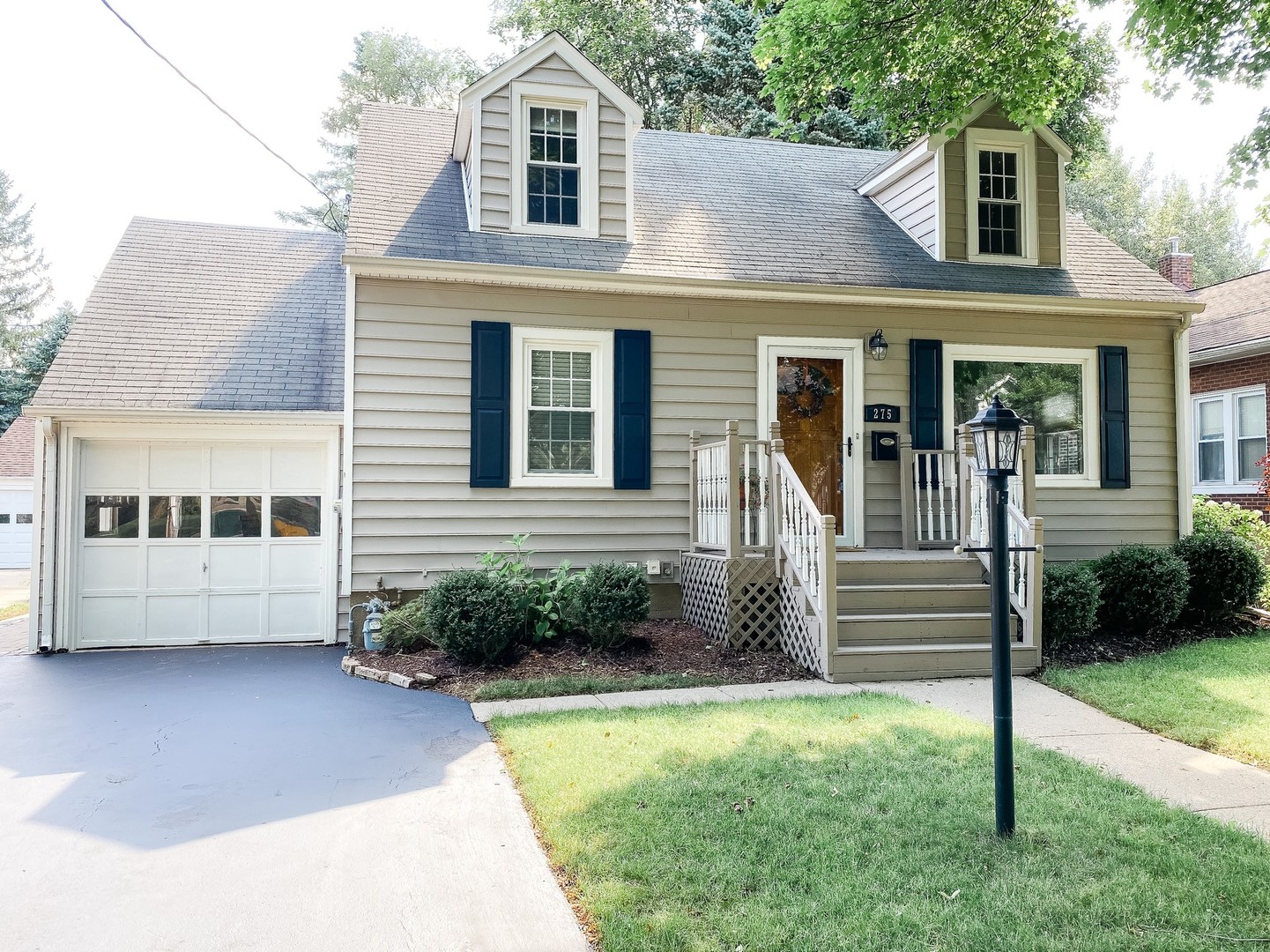 275 Harding Street Grayslake, IL 60030 - Photo 1 of 27 a front view of a house with a yard