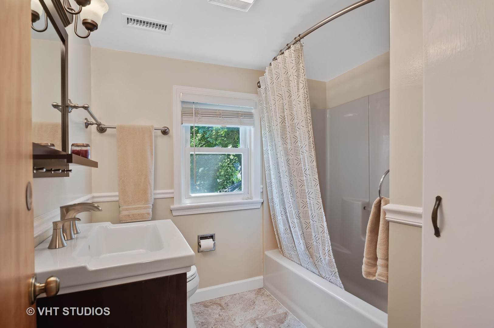 275 Harding Street Grayslake, IL 60030 - Photo 12 of 27 a bathroom with a sink a mirror and a shower