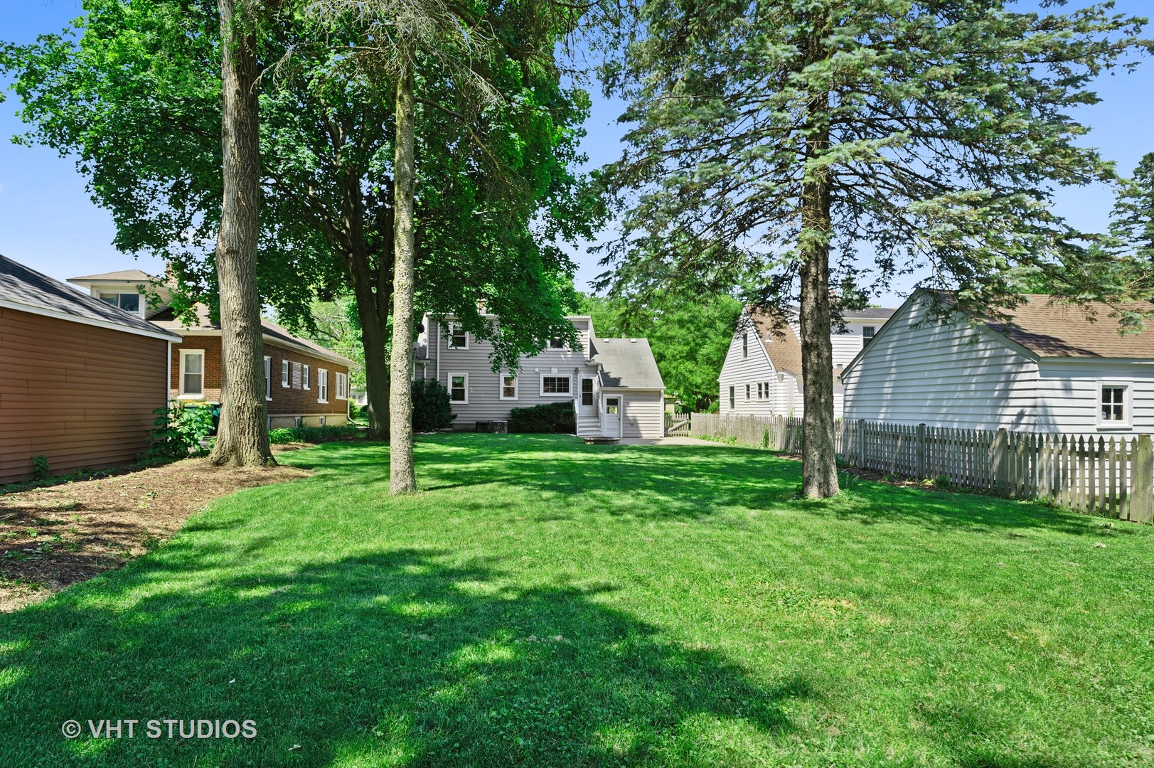 275 Harding Street Grayslake, IL 60030 - Photo 17 of 27 a backyard of a house with seating and yard