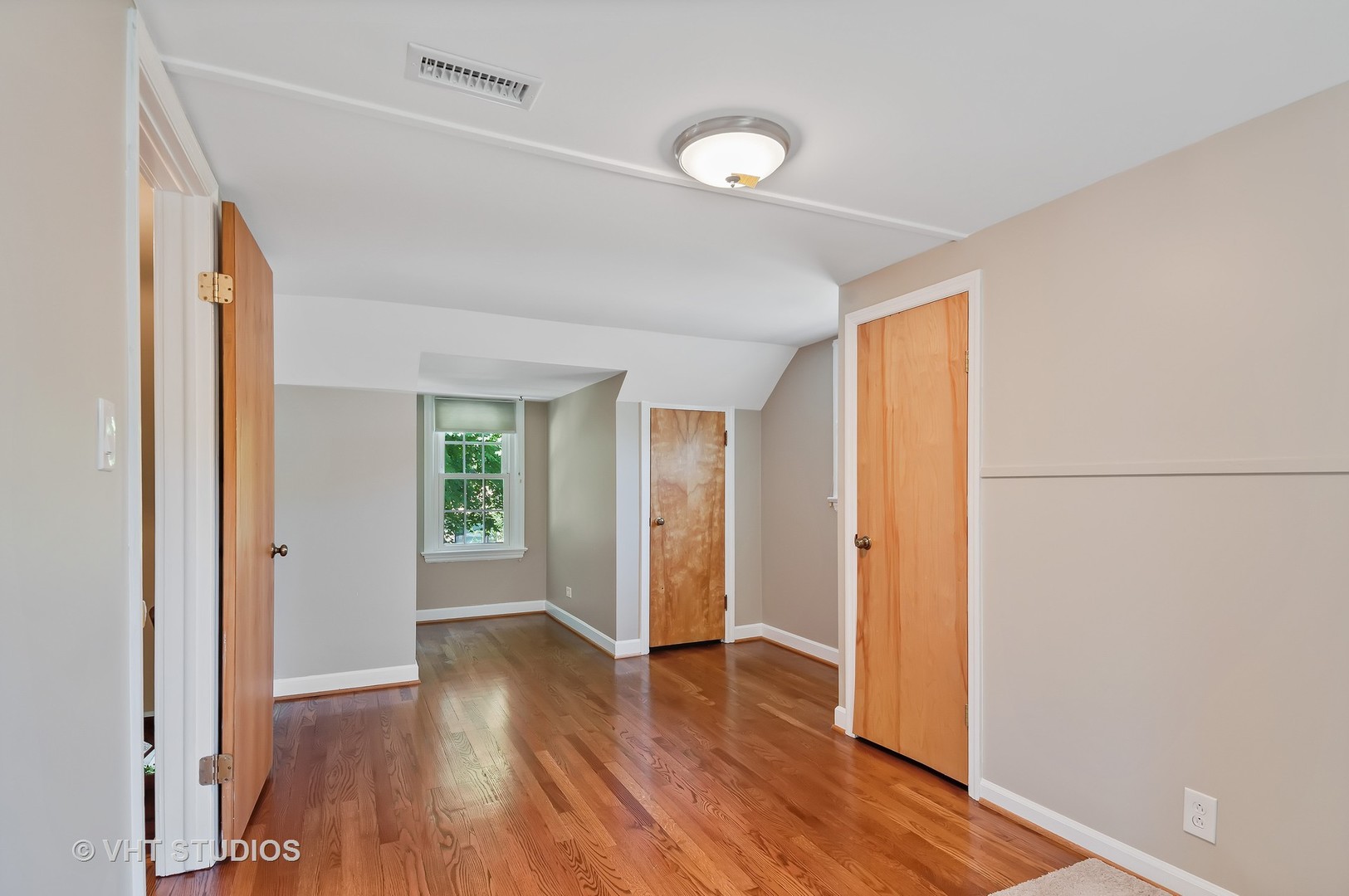 275 Harding Street Grayslake, IL 60030 - Photo 8 of 27 a view of an empty room with wooden floor and a window