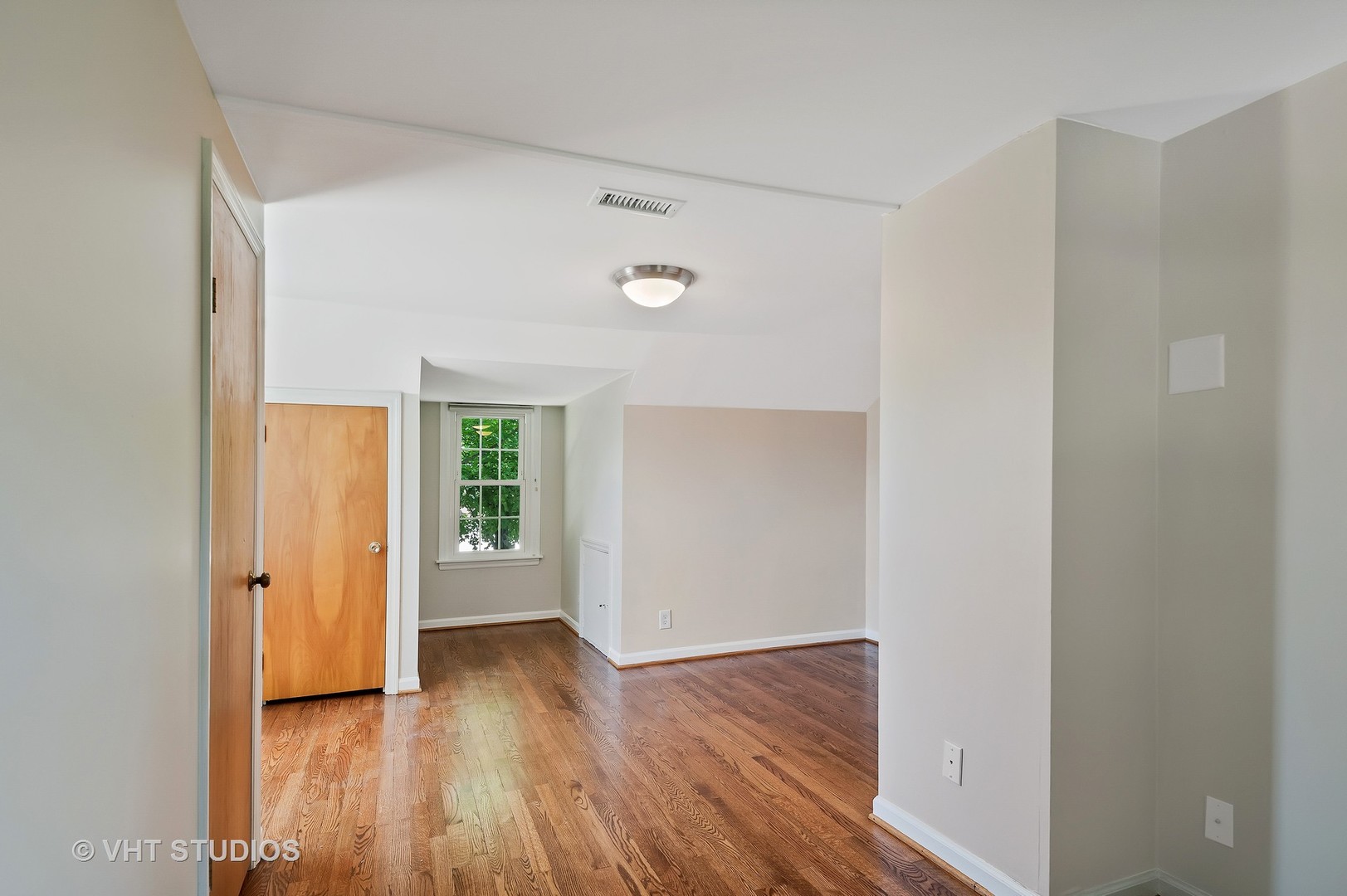 275 Harding Street Grayslake, IL 60030 - Photo 10 of 27 a view of an empty room with wooden floor and a window