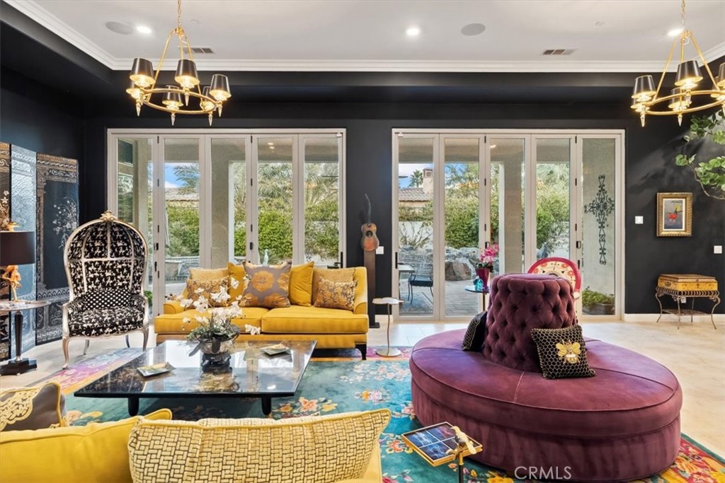 81094 Monarchos Circle La Quinta, CA 92253 - Photo 12 of 75 a living room with furniture chandelier and a large window