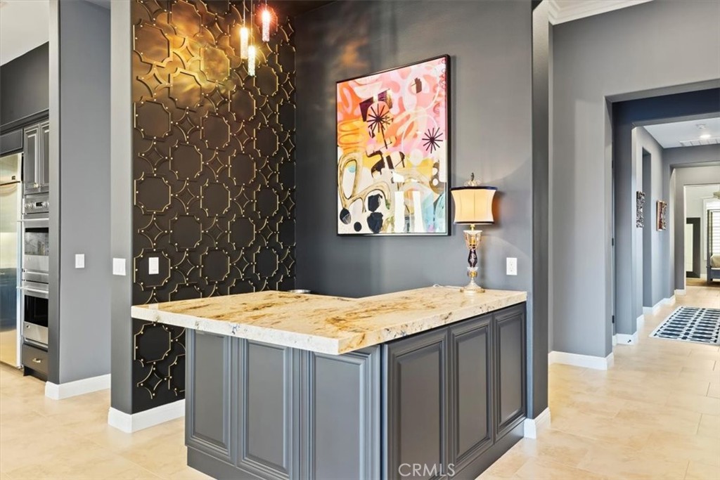 81094 Monarchos Circle La Quinta, CA 92253 - Photo 17 of 75 a room with a sink table and chairs