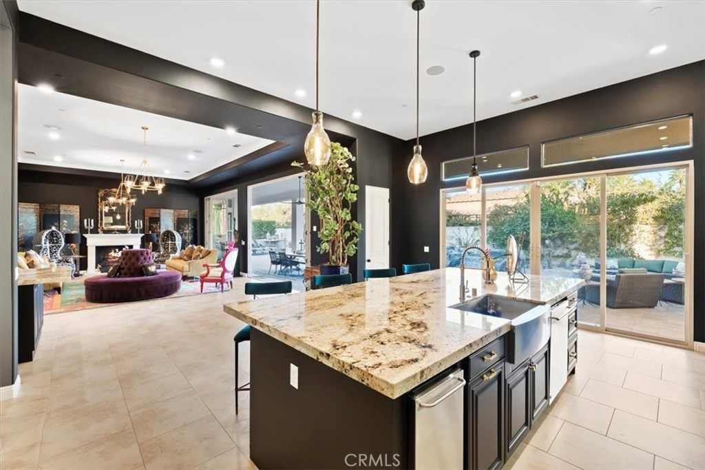 81094 Monarchos Circle La Quinta, CA 92253 - Photo 18 of 75 a view of a kitchen with kitchen island a large window in it