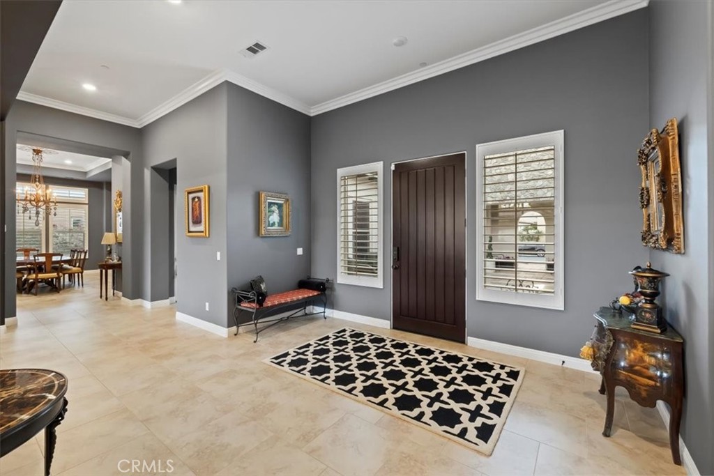 81094 Monarchos Circle La Quinta, CA 92253 - Photo 28 of 75 a bedroom with furniture and a window