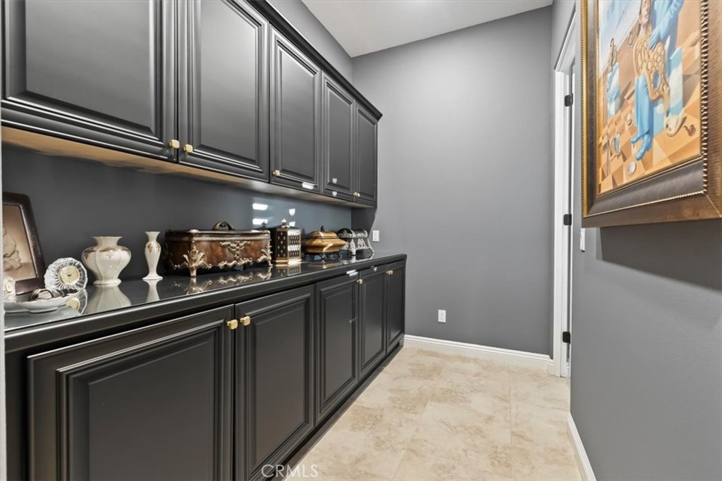 81094 Monarchos Circle La Quinta, CA 92253 - Photo 30 of 75 a kitchen with stainless steel appliances granite countertop a sink and cabinets