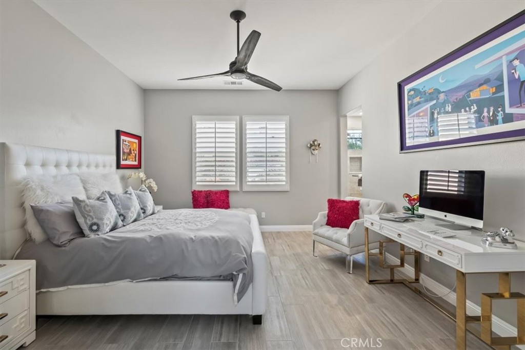 81094 Monarchos Circle La Quinta, CA 92253 - Photo 31 of 75 a bedroom with a bed and wooden floor