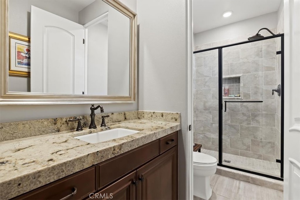 81094 Monarchos Circle La Quinta, CA 92253 - Photo 37 of 75 a bathroom with a granite countertop sink mirror and double