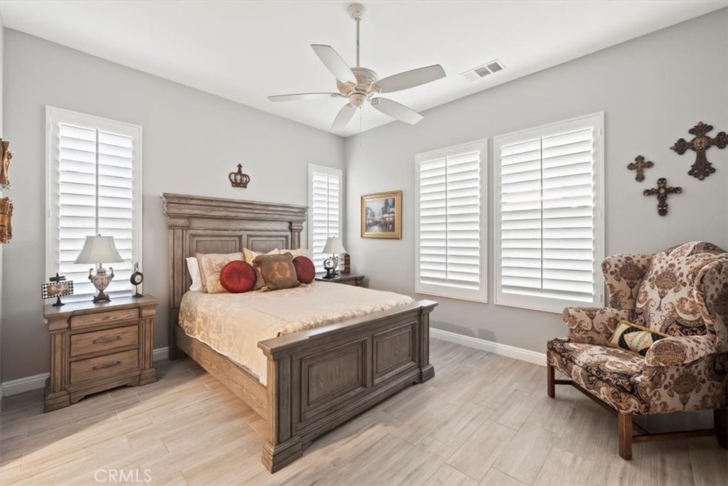 81094 Monarchos Circle La Quinta, CA 92253 - Photo 40 of 75 a bedroom with a bed and a couch