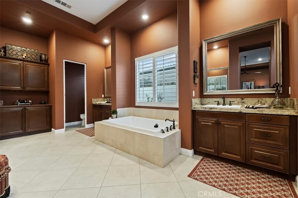 81094 Monarchos Circle La Quinta, CA 92253 - Photo 46 of 75 a spacious bathroom with a tub sink and mirror