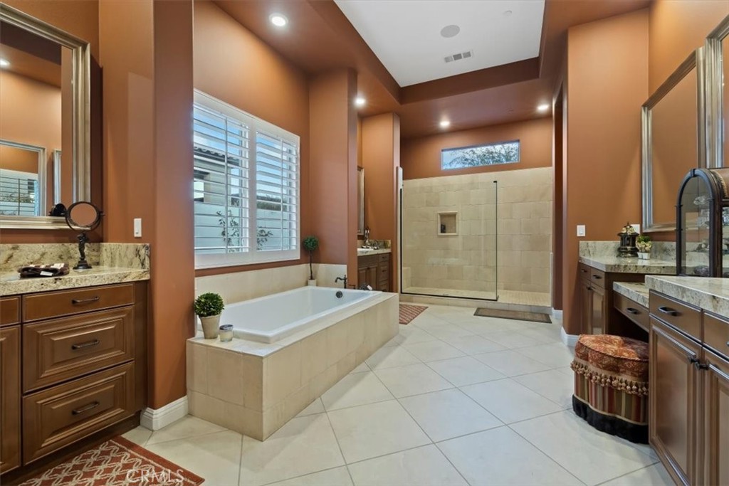 81094 Monarchos Circle La Quinta, CA 92253 - Photo 47 of 75 a spacious bathroom with a tub sink and mirror