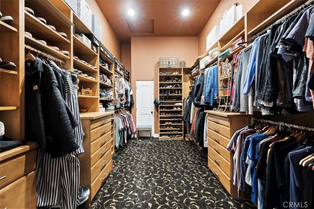 81094 Monarchos Circle La Quinta, CA 92253 - Photo 53 of 75 a view of walk in closet with clothes and shoes