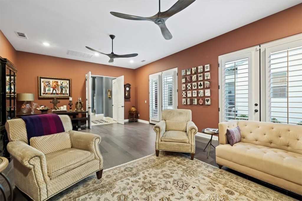 81094 Monarchos Circle La Quinta, CA 92253 - Photo 55 of 75 a living room with furniture ceiling fan and a rug